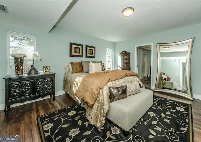 701 Riverside Dr, Tarpon Springs, FL 34689 - bedroom featuring wood finished floors and baseboards