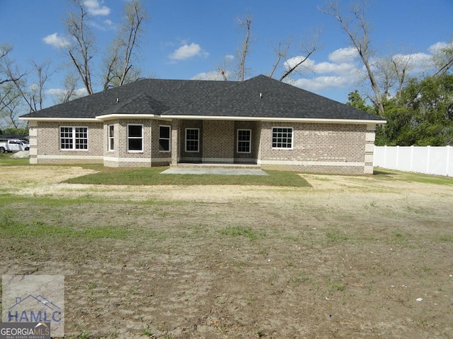 103 Abbie Ln, Glennville, GA 30427 - rear view of house with brick siding and a patio