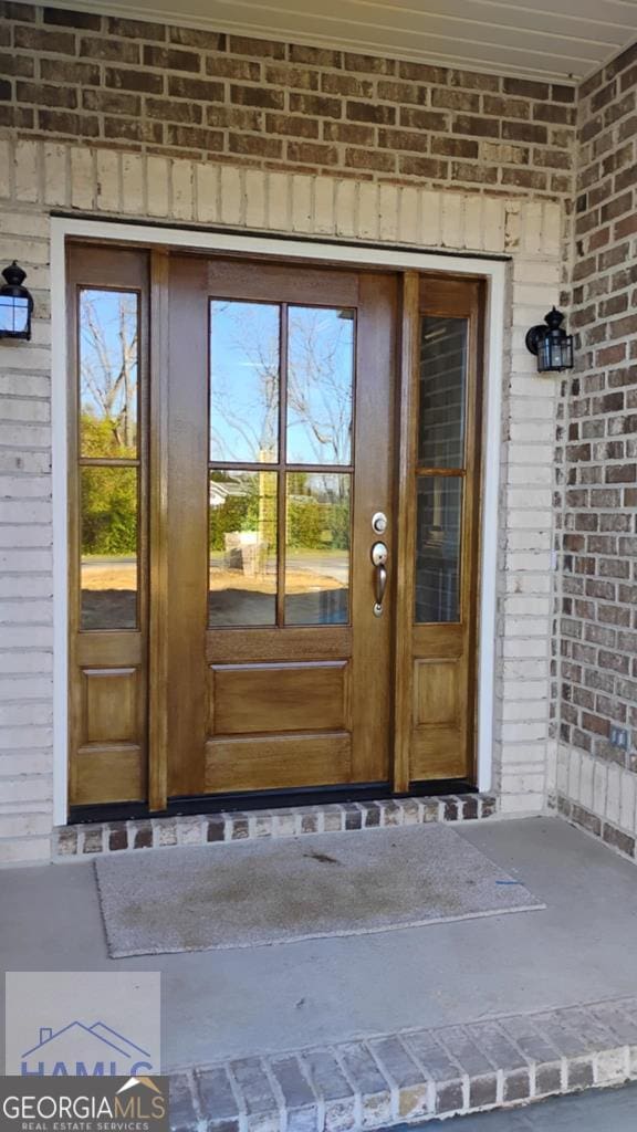 103 Abbie Ln, Glennville, GA 30427 - doorway to property featuring brick siding