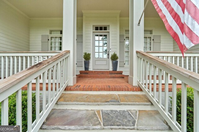 143 Wildwood Dr, Eatonton, GA 31024 - view of exterior entry featuring a porch