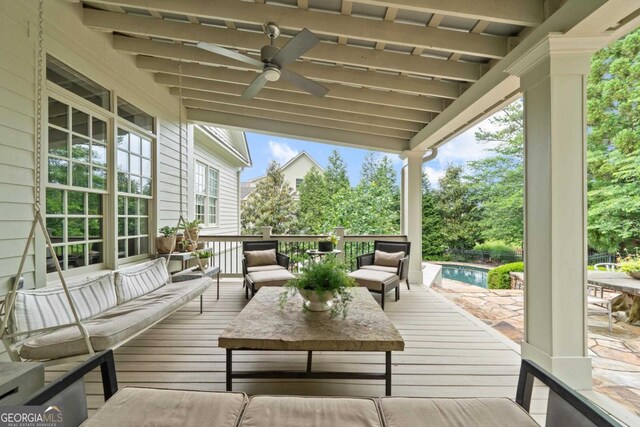 143 Wildwood Dr, Eatonton, GA 31024 - wooden deck with an outdoor living space, an outdoor pool, and a ceiling fan