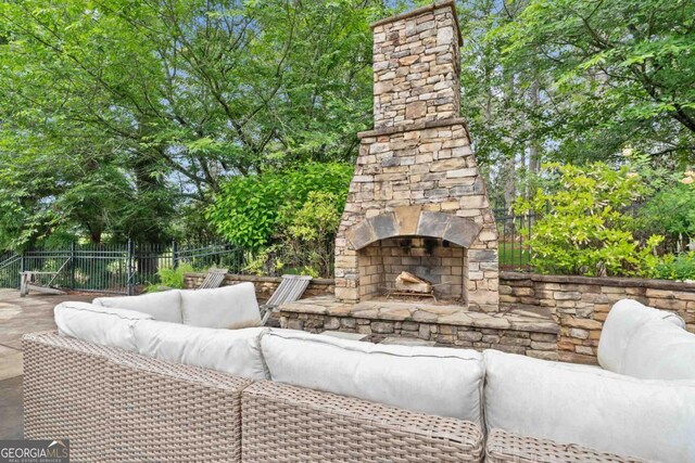 143 Wildwood Dr, Eatonton, GA 31024 - view of patio featuring fence and an outdoor living space with a fireplace