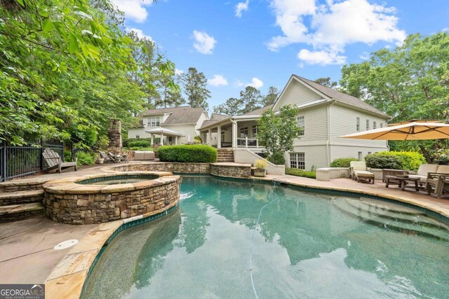 143 Wildwood Dr, Eatonton, GA 31024 - view of swimming pool with a patio and a pool with connected hot tub