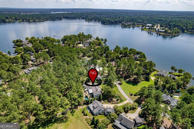 143 Wildwood Dr, Eatonton, GA 31024 - drone / aerial view of a heavily wooded area and a nearby body of water