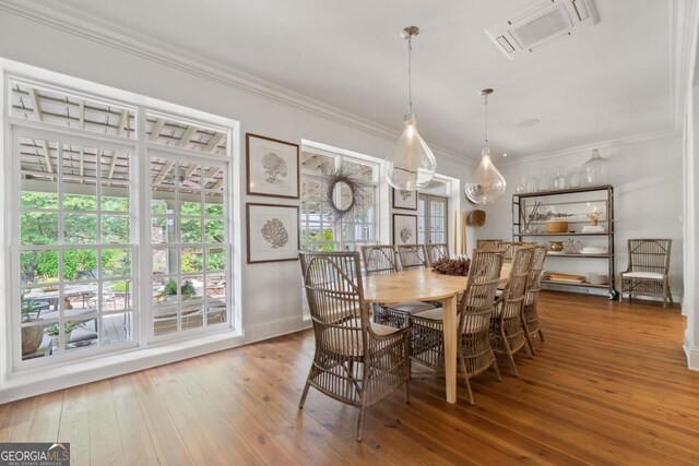 143 Wildwood Dr, Eatonton, GA 31024 - dining room featuring hardwood / wood-style flooring, ornamental molding, and baseboards
