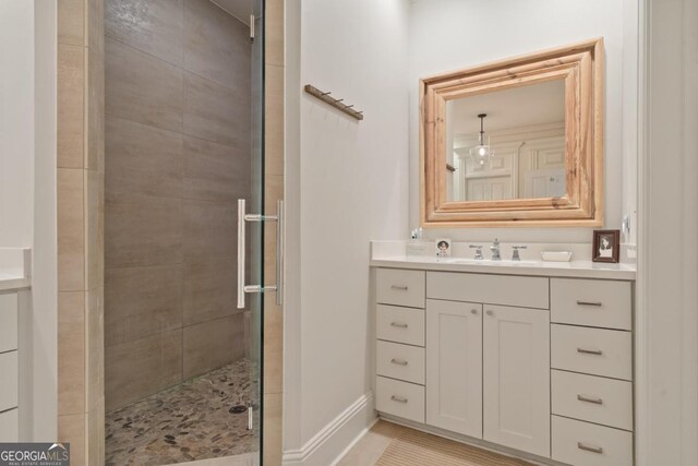 143 Wildwood Dr, Eatonton, GA 31024 - full bath with a shower stall, vanity, and baseboards