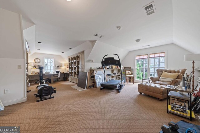143 Wildwood Dr, Eatonton, GA 31024 - carpeted living area with vaulted ceiling and a desk