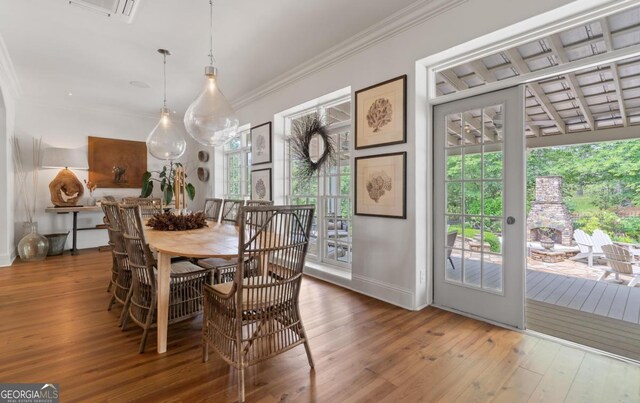143 Wildwood Dr, Eatonton, GA 31024 - dining area featuring hardwood / wood-style flooring, crown molding, and baseboards