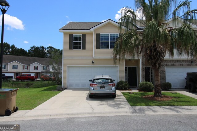 7 Bimini Dr, Savannah, GA 31419 - view of front of property featuring concrete driveway, an attached garage, and a front yard