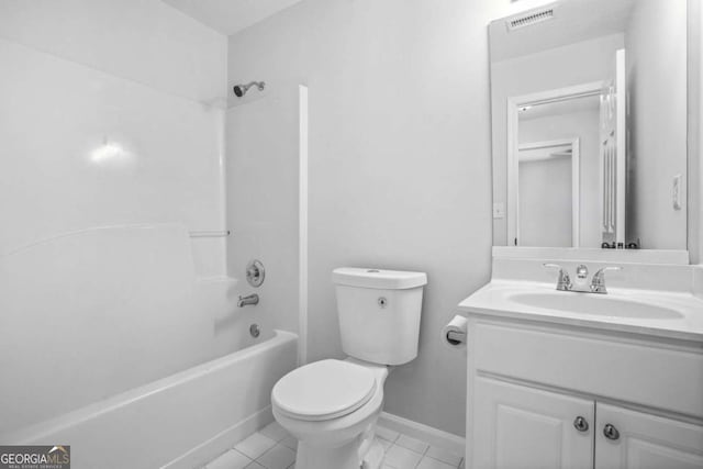 full bath featuring toilet, vanity, bathtub / shower combination, and tile patterned flooring