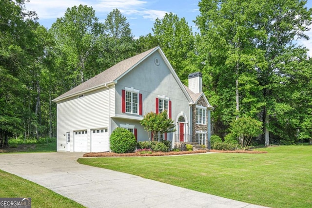 view of front of home featuring a chimney, concrete driveway, a garage, a front yard, and stucco siding
