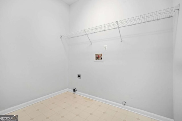 laundry room featuring electric dryer hookup, washer hookup, baseboards, tile patterned floors, and gas dryer hookup