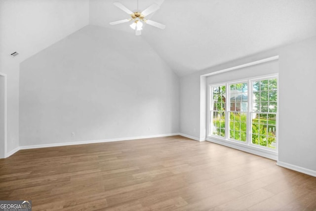 bonus room featuring vaulted ceiling, ceiling fan, wood finished floors, and baseboards