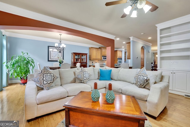living area featuring ceiling fan, a chandelier, crown molding, light wood-type flooring, and recessed lighting