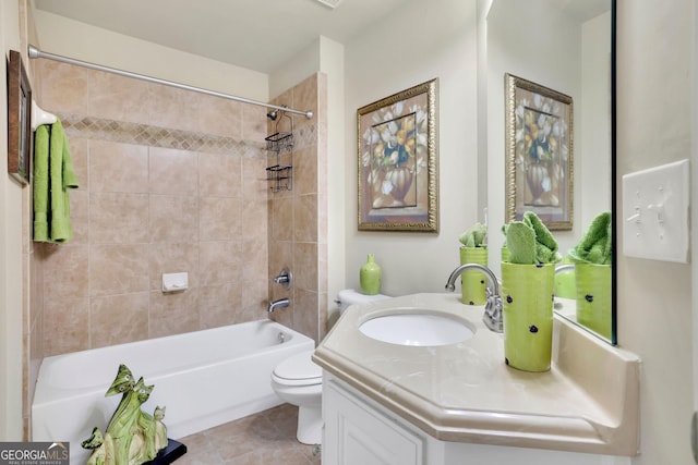 bathroom featuring toilet, vanity, shower / bath combination, and tile patterned flooring