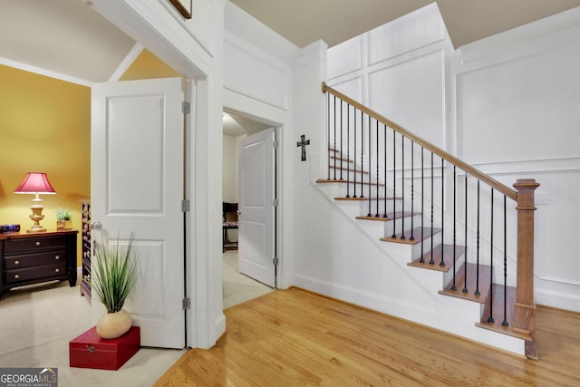 staircase featuring wood finished floors