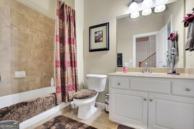 bathroom featuring tile patterned floors, toilet, vanity, shower / bath combination with curtain, and baseboards