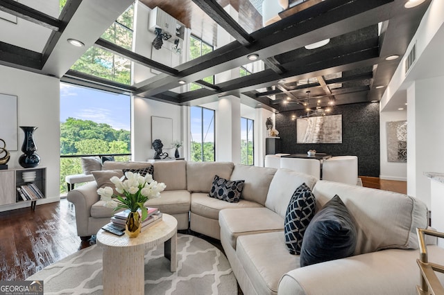 130 26th St NW Unit 801, Atlanta, GA 30309 - living area with plenty of natural light, wood finished floors, baseboards, beam ceiling, and recessed lighting