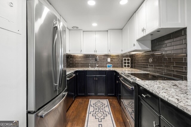 130 26th St NW Unit 801, Atlanta, GA 30309 - kitchen featuring freestanding refrigerator, electric range oven, a sink, dark wood-type flooring, and light stone countertops