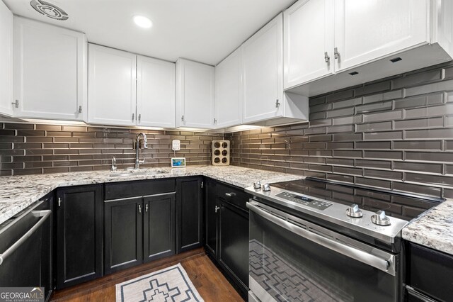 130 26th St NW Unit 801, Atlanta, GA 30309 - kitchen with appliances with stainless steel finishes, a sink, dark cabinetry, white cabinetry, and recessed lighting