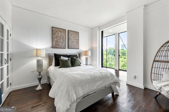 130 26th St NW Unit 801, Atlanta, GA 30309 - bedroom with wood finished floors, baseboards, and ornamental molding