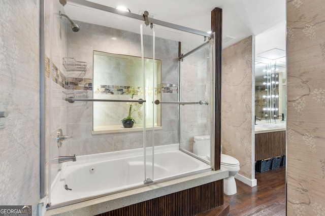 130 26th St NW Unit 801, Atlanta, GA 30309 - bathroom with toilet, combined bath / shower with glass door, vanity, and wood finished floors