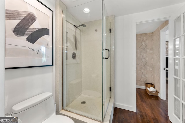 130 26th St NW Unit 801, Atlanta, GA 30309 - bathroom with a stall shower, wood finished floors, toilet, and recessed lighting