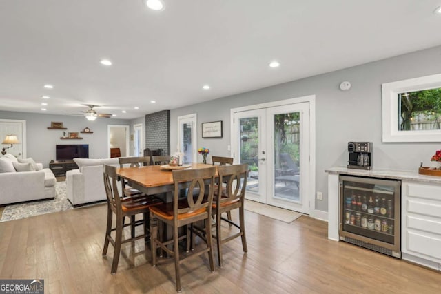1280 Sherry Dr, Alpharetta, GA 30009 - dining space featuring beverage cooler, french doors, light wood-style flooring, recessed lighting, and ceiling fan
