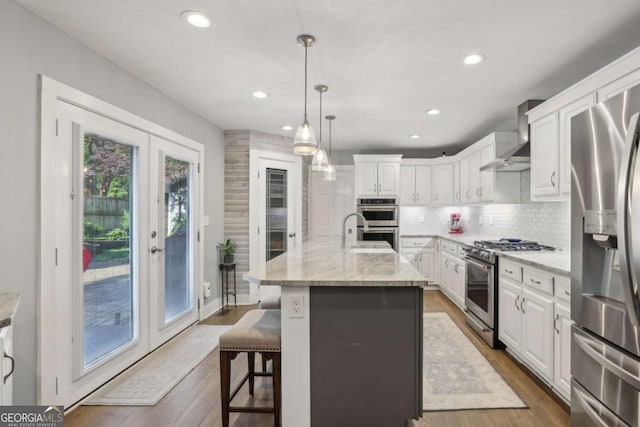 1280 Sherry Dr, Alpharetta, GA 30009 - kitchen with stainless steel appliances, french doors, white cabinetry, backsplash, and recessed lighting