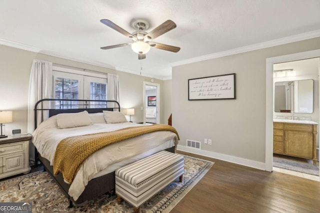 1280 Sherry Dr, Alpharetta, GA 30009 - bedroom featuring wood finished floors, ornamental molding, french doors, baseboards, and ensuite bath