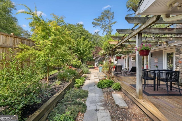 1280 Sherry Dr, Alpharetta, GA 30009 - view of yard with a wooden deck, a pergola, and outdoor dining space