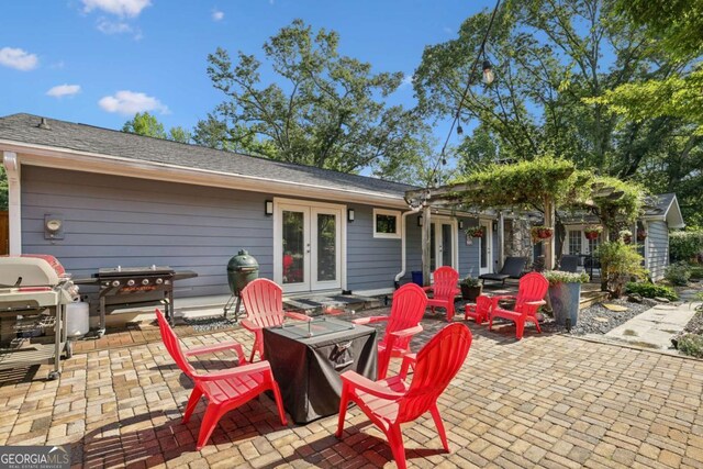 1280 Sherry Dr, Alpharetta, GA 30009 - view of patio featuring french doors and a fire pit