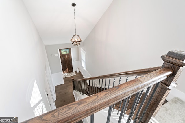 133 Wild Turkey Pass, Homer, GA 30547 - staircase with a chandelier, lofted ceiling, wainscoting, and wood finished floors