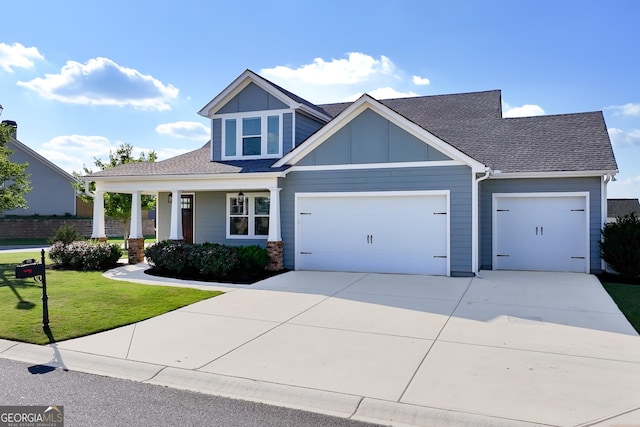 133 Wild Turkey Pass, Homer, GA 30547 - craftsman house featuring an attached garage, a front yard, concrete driveway, roof with shingles, and a porch