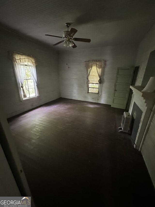 35 Hancock St, Warm Springs, GA 31830 - unfurnished living room featuring a ceiling fan and a fireplace