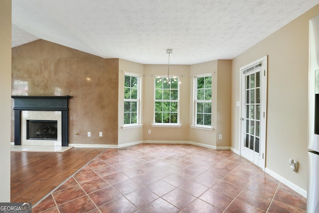 259 Pine Valley Dr, Powder Springs, GA 30127 - unfurnished living room with tile patterned floors, a high end fireplace, and a textured ceiling