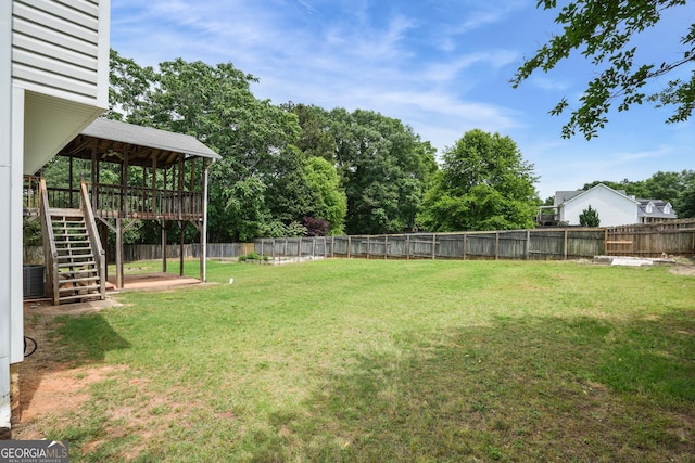 259 Pine Valley Dr, Powder Springs, GA 30127 - fenced backyard with stairs and a wooden deck