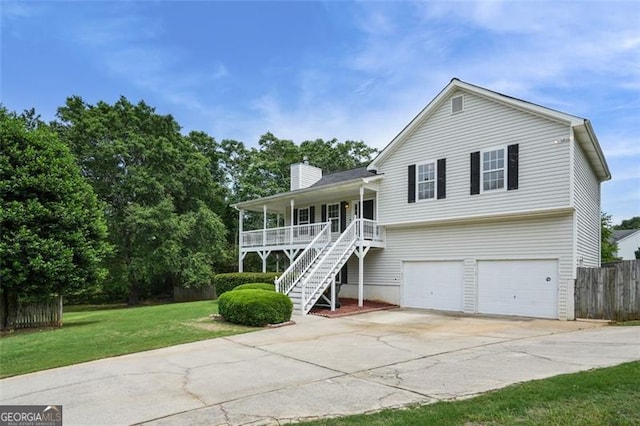 259 Pine Valley Dr, Powder Springs, GA 30127 - view of front of house featuring covered porch, stairs, concrete driveway, a chimney, and a garage