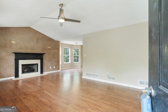 259 Pine Valley Dr, Powder Springs, GA 30127 - unfurnished living room featuring ceiling fan, light wood-style flooring, a high end fireplace, and vaulted ceiling
