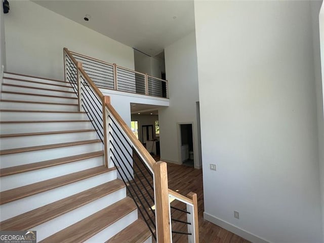 4107 Danforth, Atlanta, GA 30331 - staircase featuring wood finished floors and a towering ceiling
