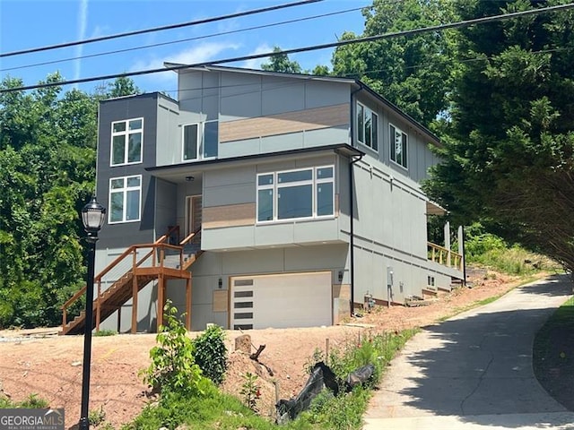 4107 Danforth, Atlanta, GA 30331 - contemporary home featuring stairway, driveway, and a garage