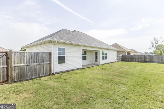 rear view of property featuring roof with shingles
