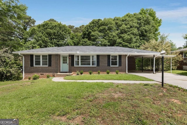 ranch-style house featuring concrete driveway, brick siding, an attached carport, and a front lawn