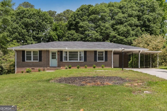 view of front facade with brick siding, a front lawn, concrete driveway, and a carport