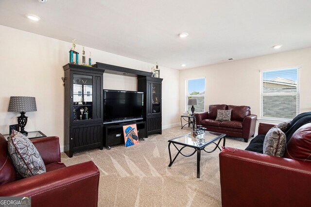 320 Conley Ave, Hampton, GA 30228 - living room featuring light carpet and recessed lighting