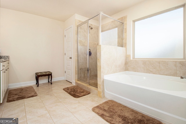 320 Conley Ave, Hampton, GA 30228 - full bathroom featuring a bath, a stall shower, vanity, and tile patterned flooring