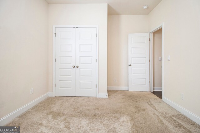 320 Conley Ave, Hampton, GA 30228 - unfurnished bedroom featuring carpet and a closet