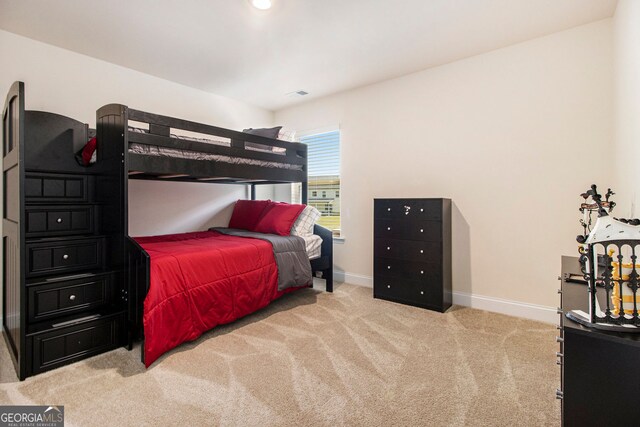 320 Conley Ave, Hampton, GA 30228 - carpeted bedroom featuring baseboards