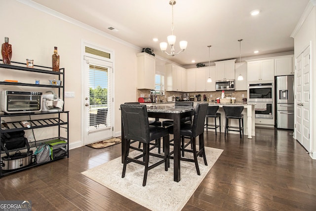 320 Conley Ave, Hampton, GA 30228 - dining room with a chandelier, ornamental molding, dark wood-type flooring, and recessed lighting
