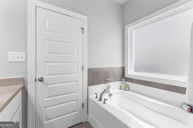 10 Georgian Oaks Ct, Newnan, GA 30265 - bathroom featuring a garden tub and vanity